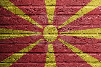 Brick wall with a painting of a flag isolated, Macedonia