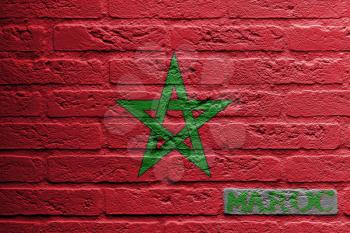 Brick wall with a painting of a flag isolated, Morocco