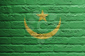 Brick wall with a painting of a flag isolated, Mauritania