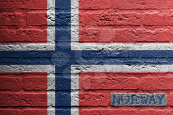 Brick wall with a painting of a flag isolated, Norway