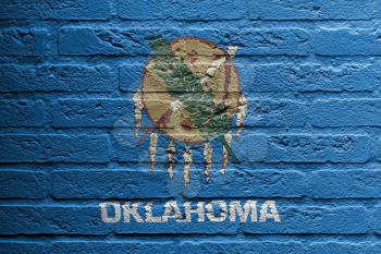 Brick wall with a painting of a flag isolated, Oklahoma
