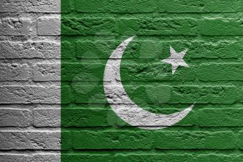 Brick wall with a painting of a flag isolated, Pakistan