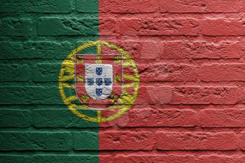 Brick wall with a painting of a flag isolated, Portugal