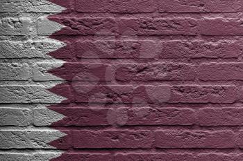 Brick wall with a painting of a flag isolated, Qatar