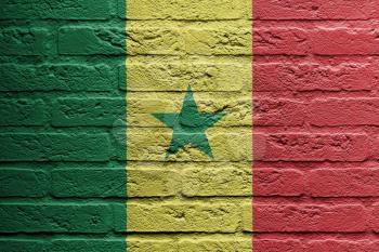 Brick wall with a painting of a flag isolated, Senegal