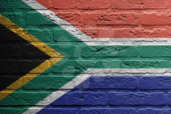 Brick wall with a painting of a flag isolated, South Africa