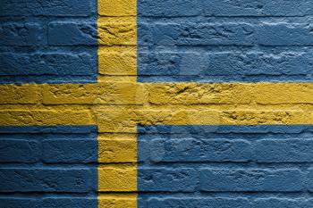 Brick wall with a painting of a flag isolated, Sweden