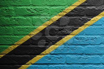 Brick wall with a painting of a flag isolated, Tanzania