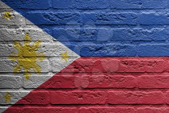 Brick wall with a painting of a flag isolated, The Philippines
