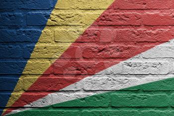 Brick wall with a painting of a flag isolated, The Seychelles