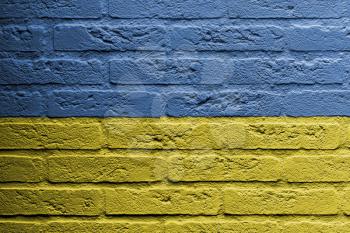 Brick wall with a painting of a flag isolated, Ukraine