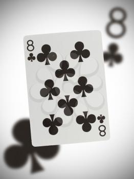 Playing card with a blurry background, eight