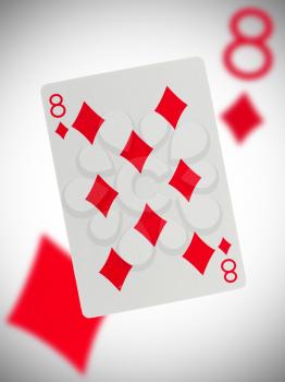 Playing card with a blurry background, eight