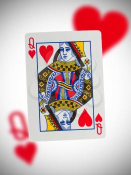 Playing card with a blurry background, queen of hearts