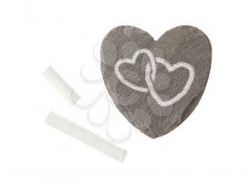 Heart shaped piece of slate over white, two white hearts