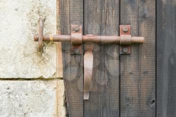 Wrought iron lock old wooden door, portrait
