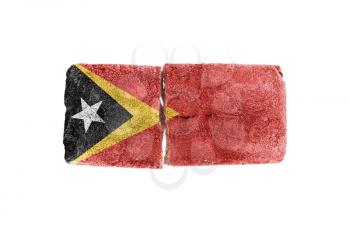 Rough broken brick, isolated on white background, flag of East Timor