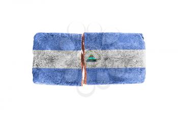 Rough broken brick, isolated on white background, flag of Nicaragua