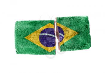 Rough broken brick, isolated on white background, flag of Brazil
