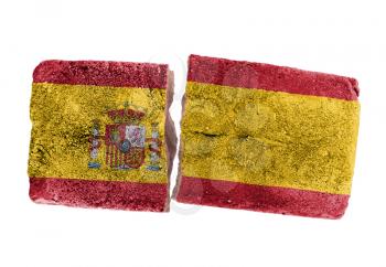 Rough broken brick, isolated on white background, flag of Spain
