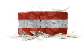 Brick with broken glass, violence concept, flag of Austria