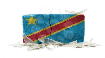Brick with broken glass, violence concept, flag of Congo