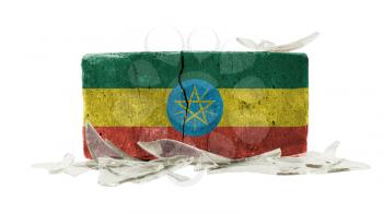 Brick with broken glass, violence concept, flag of Ethiopia
