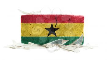 Brick with broken glass, violence concept, flag of Ghana