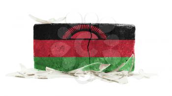 Brick with broken glass, violence concept, flag of Malawi