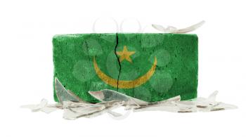 Brick with broken glass, violence concept, flag of Mauritania