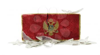 Brick with broken glass, violence concept, flag of Montenegro