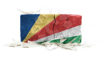 Brick with broken glass, violence concept, flag of Seychelles