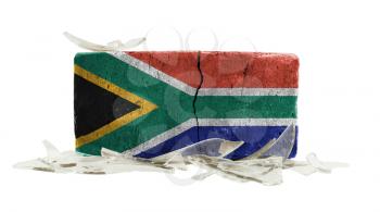 Brick with broken glass, violence concept, flag of South Africa
