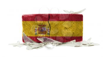 Brick with broken glass, violence concept, flag of Spain