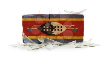 Brick with broken glass, violence concept, flag of Swaziland