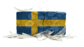 Brick with broken glass, violence concept, flag of Sweden