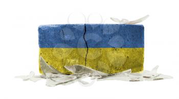 Brick with broken glass, violence concept, flag of Ukraine