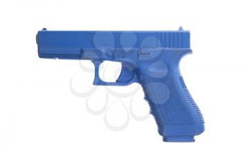 Dirty blue training gun isolated on white, law enforcement