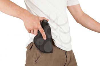 Close-up of a man with his hand on a gun, isolated on white