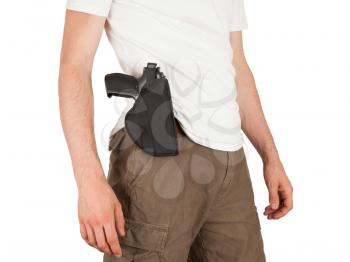 Close-up of a man with holster and a gun, isolated on white