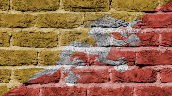 Very old brick wall texture, flag of Bhutan