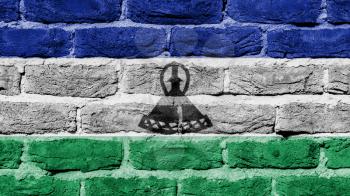 Very old brick wall texture, flag of Lesotho