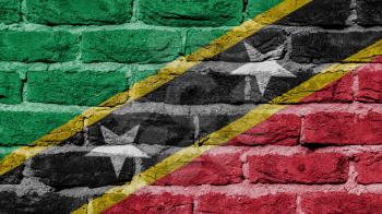 Very old brick wall texture, flag of Saint Kitts and Nevis