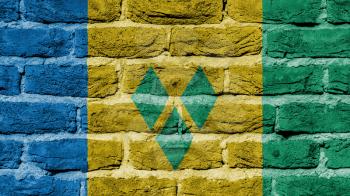 Very old brick wall texture, flag of Saint Vincent and the Grenadines