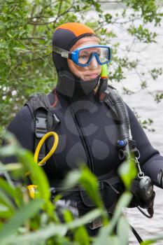 Close-up of a woman, scuba-diver gear