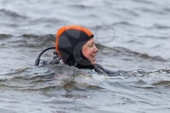 Close-up of a woman, scuba-diver gear