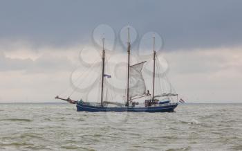 Large sailboat in the waters of the dutch Ijsselmeer, Holland