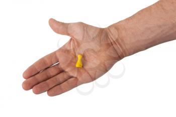 Hand holding a yellow pawn, isolated on white