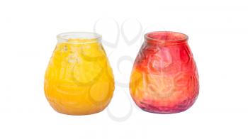 Red and yellow candle in glass, isolated on white