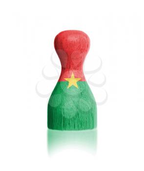 Wooden pawn with a painting of a flag, Burkina Faso